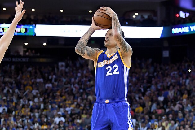 OAKLAND, CA - APRIL 02:  Matt Barnes #22 of the Golden State Warriors shoots over Bojan Bogdanovic #44 of the Washington Wizards during an NBA Basketball game at ORACLE Arena on April 2, 2017 in Oakland, California. NOTE TO USER: User expressly acknowledges and agrees that, by downloading and or using this photograph, User is consenting to the terms and conditions of the Getty Images License Agreement.  (Photo by Thearon W. Henderson/Getty Images)