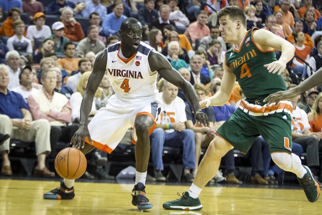 CHARLOTTESVILLE, VA - FEBRUARY 20: Marial Shayok #4 of the Virginia Cavaliers is guarded by Dejan Vasiljevic #4 of the Miami Hurricanes during a game at John Paul Jones Arena on February 20, 2017 in Charlottesville, Virginia. (Photo by Chet Strange/Getty Images)