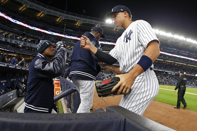 NEW YORK, NY - APRIL 19: Aaron Judge #99 of the New York Yankees is congratulated by Luis Severino #40 during a game against the Chicago White Sox at Yankee Stadium on April 19, 2017 in New York City. (Photo by Rich Schultz/Getty Images)