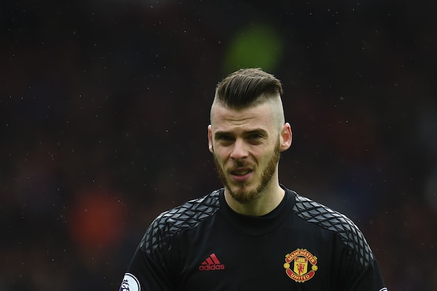 Manchester United's Spanish goalkeeper David de Gea looks on prior to the English Premier League football match between Manchester United and Chelsea at Old Trafford in Manchester, north west England, on April 16, 2017. / AFP PHOTO / Oli SCARFF / RESTRICTED TO EDITORIAL USE. No use with unauthorized audio, video, data, fixture lists, club/league logos or 'live' services. Online in-match use limited to 75 images, no video emulation. No use in betting, games or single club/league/player publications.  /         (Photo credit should read OLI SCARFF/AFP/Getty Images)