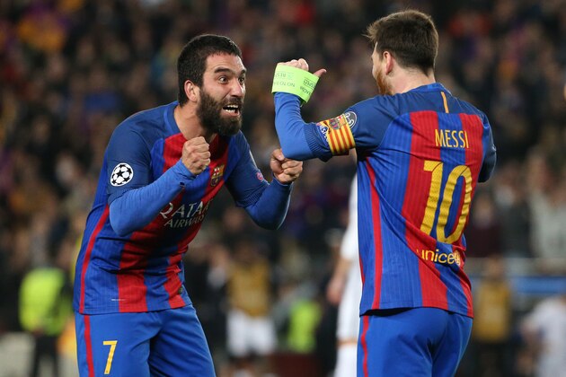 BARCELONA, SPAIN - MARCH 8: Arda Turan and Lionel Messi of FC Barcelona celebrate the victory following the UEFA Champions League Round of 16 second leg match between FC Barcelona and Paris Saint-Germain (PSG) at Camp Nou on March 8, 2017 in Barcelona, Spain. (Photo by Jean Catuffe/Getty Images)