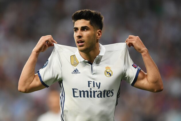MADRID, SPAIN - APRIL 18:  Marco Asensio of Real Madrid celebrates scoring his sides fourth goal during the UEFA Champions League Quarter Final second leg match between Real Madrid CF and FC Bayern Muenchen at Estadio Santiago Bernabeu on April 18, 2017 in Madrid, Spain.  (Photo by Shaun Botterill/Getty Images)