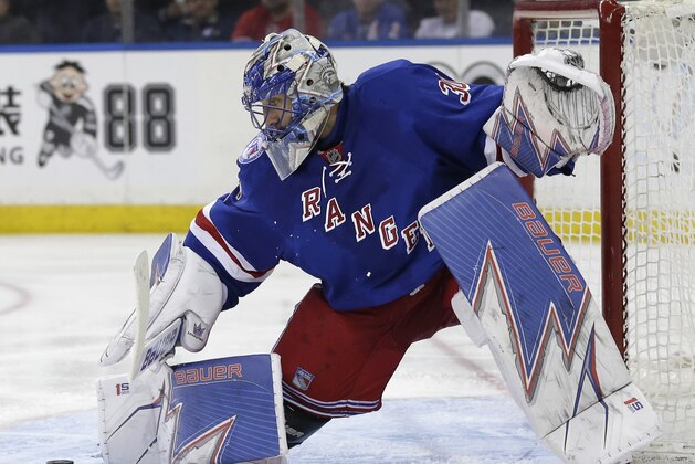 New York Rangers goalie Henrik Lundqvist makes a save during the third period in Game 3 of an NHL hockey first-round playoff series against the Montreal Canadiens, Sunday, April 16, 2017, in New York. The Canadiens defeated the Rangers 3-1. (AP Photo/Seth Wenig)