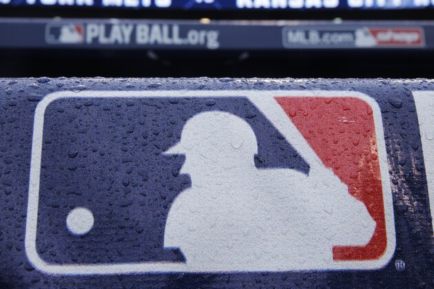 Rain drops cover a baseball logo before Game 1 of the Major League Baseball World Series between the New York Mets and Kansas City Royals, Tuesday, Oct. 27, 2015, in Kansas City, Mo. (AP Photo/Matt Slocum) Rain drops cover a baseball logo before Game 1 of the Major League Baseball World Series between the New York Mets and Kansas City Royals, Tuesday, Oct. 27, 2015, in Kansas City, Mo. (AP Photo/Matt Slocum)