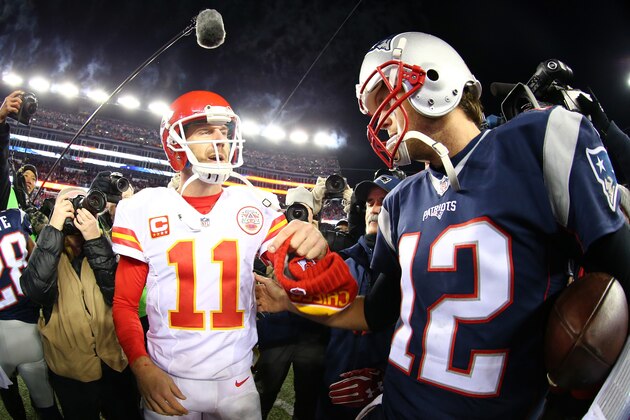 FOXBORO, MA - JANUARY 16:  Alex Smith #11 of the Kansas City Chiefs and Tom Brady #12 of the New England Patriots speak after the AFC Divisional Playoff Game at Gillette Stadium on January 16, 2016 in Foxboro, Massachusetts. The Patriots defeated the Chiefs 27-20.  (Photo by Maddie Meyer/Getty Images)