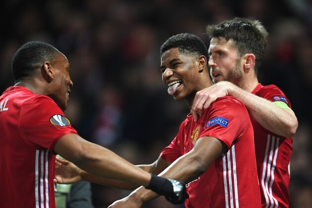 MANCHESTER, ENGLAND - APRIL 20:  Marcus Rashford of Manchester United celebrates with team mates as he scores their second goal during the UEFA Europa League quarter final second leg match between Manchester United and RSC Anderlecht at Old Trafford on April 20, 2017 in Manchester, United Kingdom.  (Photo by Laurence Griffiths/Getty Images)