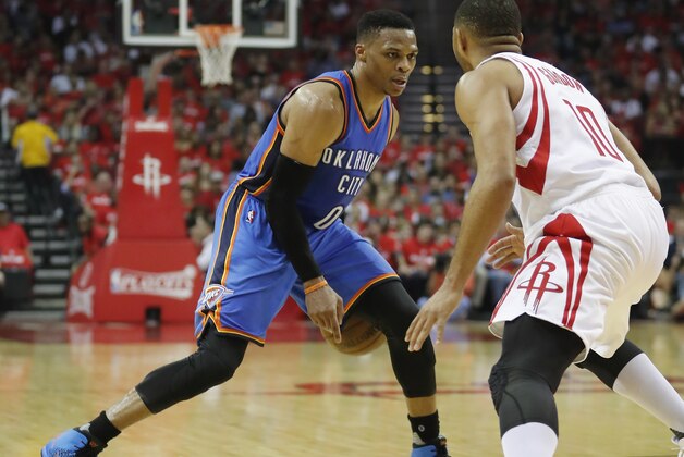 HOUSTON, TX - APRIL 19:  Russell Westbrook #0 of the Oklahoma City Thunder dribbles the ball defended by Eric Gordon #10 of the Houston Rockets in the second half of Game Two of the Western Conference quarterfinals game during the 2017 NBA Playoffs at Toyota Center on April 19, 2017 in Houston, Texas. NOTE TO USER: User expressly acknowledges and agrees that, by downloading and or using this photograph, User is consenting to the terms and conditions of the Getty Images License Agreement.  (Photo by Tim Warner/Getty Images)
