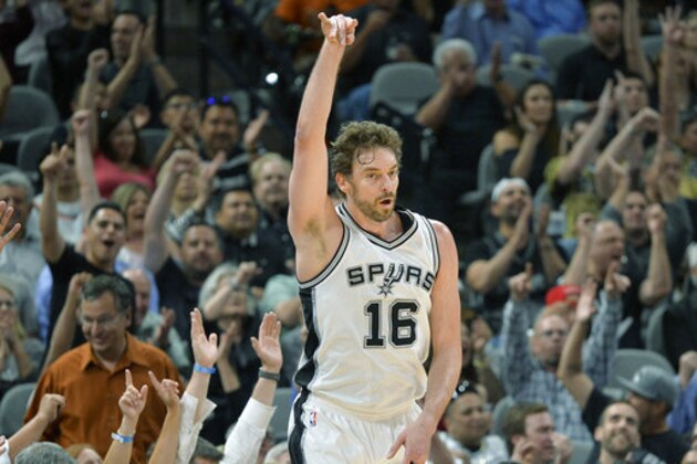 San Antonio Spurs center Pau Gasol, of Spain, celebrates a 3-point basket during the first half of an NBA basketball game against the Cleveland Cavaliers, Monday, March 27, 2017, in San Antonio. (AP Photo/Darren Abate)