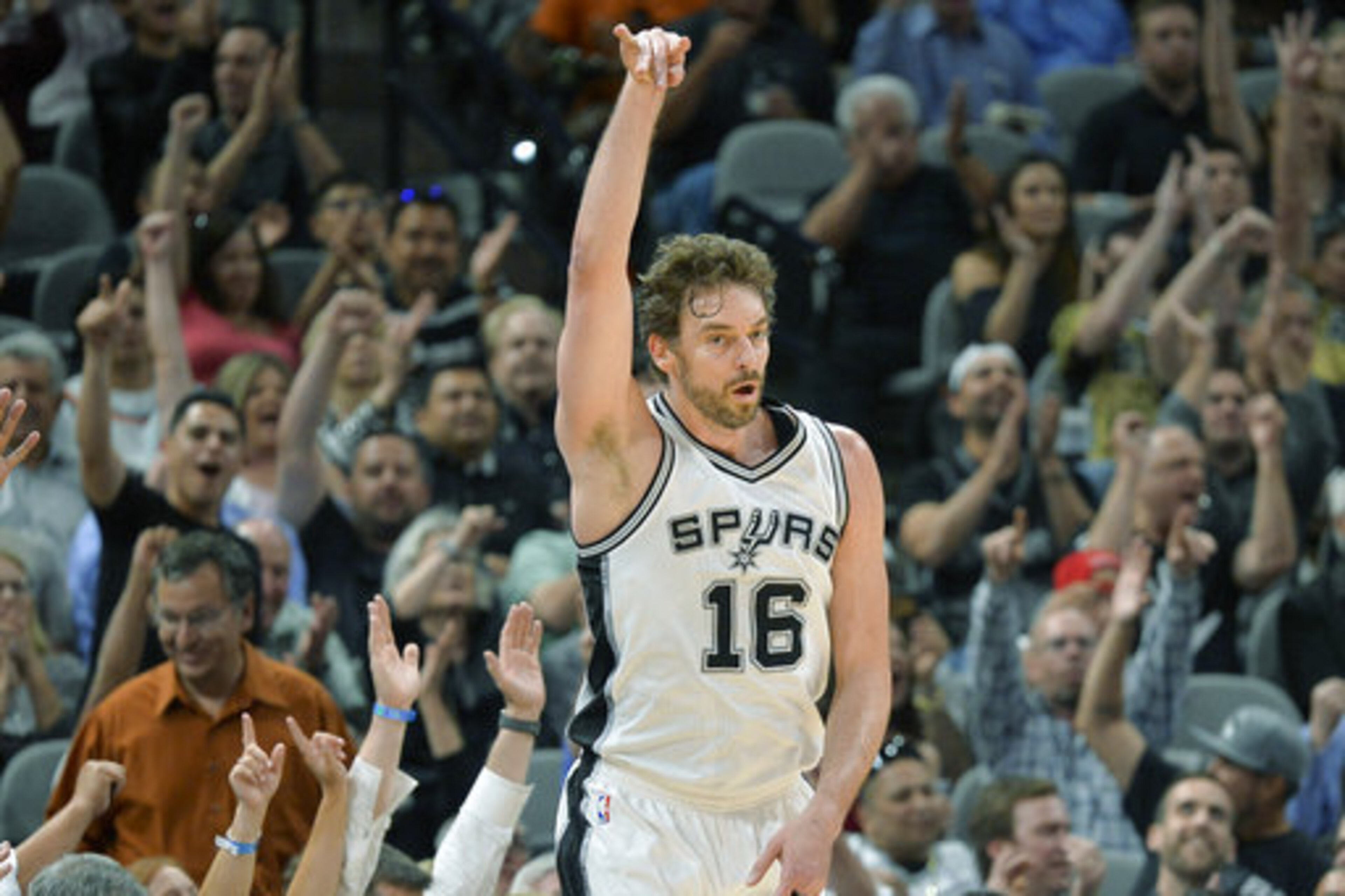 San Antonio Spurs center Pau Gasol, of Spain, celebrates a 3-point basket during the first half of an NBA basketball game against the Cleveland Cavaliers, Monday, March 27, 2017, in San Antonio. (AP Photo/Darren Abate)