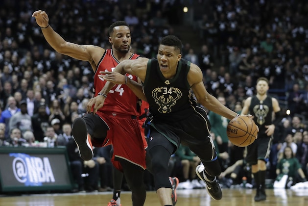 Milwaukee Bucks' Giannis Antetokounmpo drives past Toronto Raptors' Norman Powell during the second half of game 3 of their NBA first-round playoff series basketball game Thursday, April 20, 2017, in Milwaukee. (AP Photo/Morry Gash)