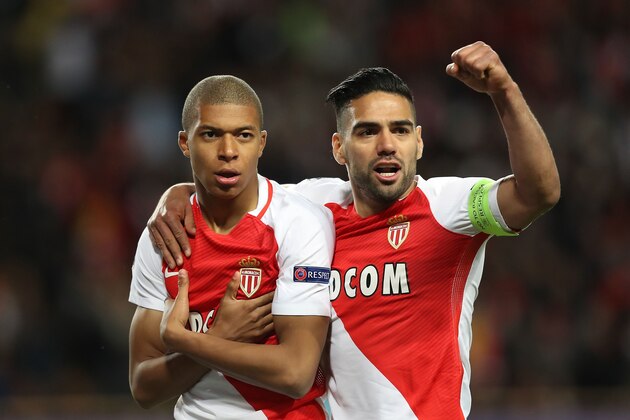 Monaco's French forward Kylian Mbappe Lottin (L) and Monaco's Colombian forward Radamel Falcao celebrate after Mbappe opened the scoring during the UEFA Champions League 2nd leg quarter-final football match AS Monaco v BVB Borussia Dortmund on April 19, 2017 at the Louis II stadium in Monaco.  / AFP PHOTO / Valery HACHE        (Photo credit should read VALERY HACHE/AFP/Getty Images)