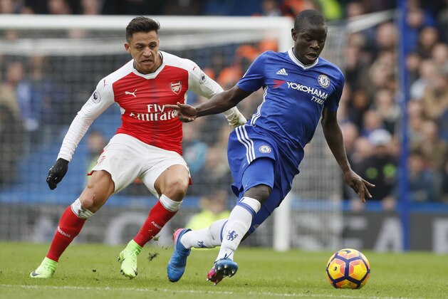 Chelsea's N'Golo Kante, right holds off the challenge of Arsenal's Alexis Sanchez during the English Premier League soccer match between Chelsea and Arsenal at Stamford Bridge stadium in London, Saturday, Feb. 4, 2017. (AP Photo/Kirsty Wigglesworth)