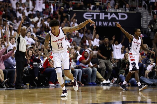 WASHINGTON, DC - APRIL 16: Kelly Oubre Jr. #12 of the Washington Wizards celebrates after hitting a three pointer against the Atlanta Hawks in the second half of Game One of the Eastern Conference Quarterfinals during the 2017 NBA Playoffs at Verizon Center on April 16, 2017 in Washington, DC. NOTE TO USER: User expressly acknowledges and agrees that, by downloading and or using this photograph, User is consenting to the terms and conditions of the Getty Images License Agreement.  (Photo by Rob Carr/Getty Images)