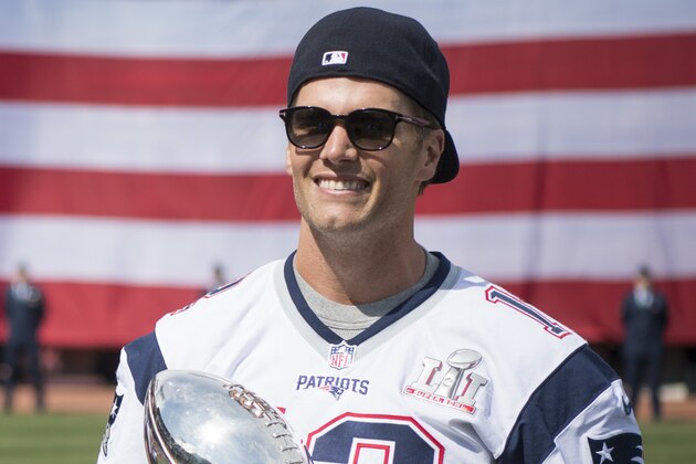 BOSTON, MA - APRIL 03:  Tom Brady #12 of the New England Patriots wears his recovered Super Bowl jersey during a ceremony honoring the Super Bowl champions at Fenway Park before an opening gay game between the Boston Red Sox and the Pittsburgh Pirates on April 3, 2017 in Boston, Massachusetts. (Photo by Michael Ivins/Boston Red Sox/Getty Images)