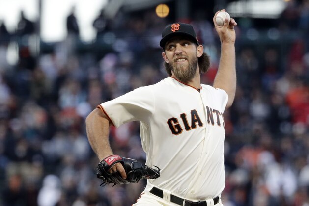 San Francisco Giants starting pitcher Madison Bumgarner throws to the Colorado Rockies during the first inning of a baseball game, Thursday, April 13, 2017, in San Francisco. (AP Photo/Marcio Jose Sanchez)