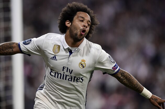 Real Madrid's Brazilian defender Marcelo celebrates at the end of the UEFA Champions League quarter-final second leg football match Real Madrid vs FC Bayern Munich at the Santiago Bernabeu stadium in Madrid in Madrid on April 18, 2017. / AFP PHOTO / JAVIER SORIANO        (Photo credit should read JAVIER SORIANO/AFP/Getty Images)