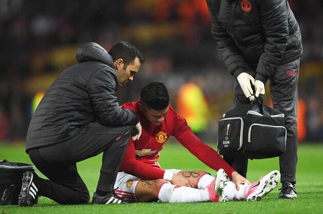 MANCHESTER, ENGLAND - APRIL 20:  An injured Marcos Rojo of Manchester United is given treatment during the UEFA Europa League quarter final second leg match between Manchester United and RSC Anderlecht at Old Trafford on April 20, 2017 in Manchester, United Kingdom.  (Photo by Laurence Griffiths/Getty Images)