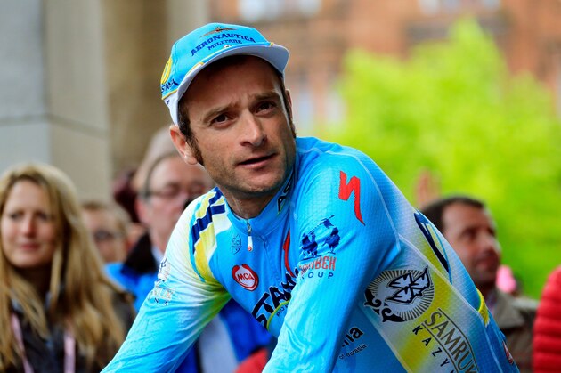 Italian cyclist Michele Scarponi of the Astana team looks on during the presentation of the teams for the 97th Giro d'Italia, Tour of Italy in Belfast on May 8, 2014. AFP PHOTO/LUK BENIES / AFP PHOTO / LUK BENIES        (Photo credit should read LUK BENIES/AFP/Getty Images)