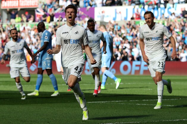 SWANSEA, WALES - APRIL 22: Tom Carroll of Swansea City celebrates scoring his side's second goal of the match during the Premier League match between Swansea City and Stoke City at The Liberty Stadium on April 22, 2017 in Swansea, Wales. (Photo by Athena Pictures/Getty Images)