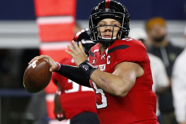 FILE  - In this Nov. 25, 2016, file photo, Texas Tech quarterback Patrick Mahomes looks to throw against Baylor during the first half of an NCAA college football game in Arlington, Texas. Mahomes is bypassing his senior season for early entry in the NFL draft. Mahomes, the FBS leader this season with 5,052 yards passing, announced his decision during a campus news conference Tuesday, Jan. 3, 2017. (AP Photo/Ron Jenkins, File)