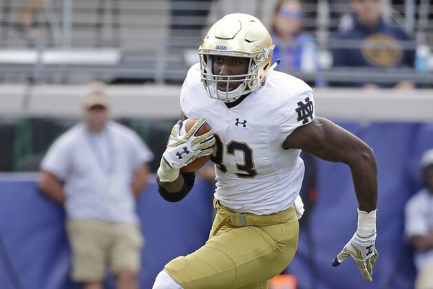 Notre Dame running back Josh Adams runs against Navy during the second half of an NCAA college football game Saturday, Nov. 5, 2016, in Jacksonville, Fla. Navy won 28-27. (AP Photo/John Raoux)