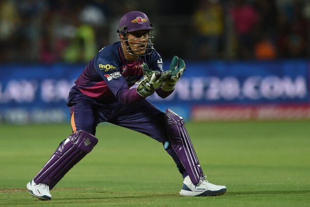 Rising Pune Supergiants captain Mahendra Singh Dhoni collects a throw from the outfield during the 2016 Indian Premier League (IPL) Twenty20 cricket match between Rising Pune Supergiants and Gujarat Lions at The Maharashtra Cricket Association Stadium in Pune on April 29, 2016.   / AFP / INDRANIL MUKHERJEE        (Photo credit should read INDRANIL MUKHERJEE/AFP/Getty Images)