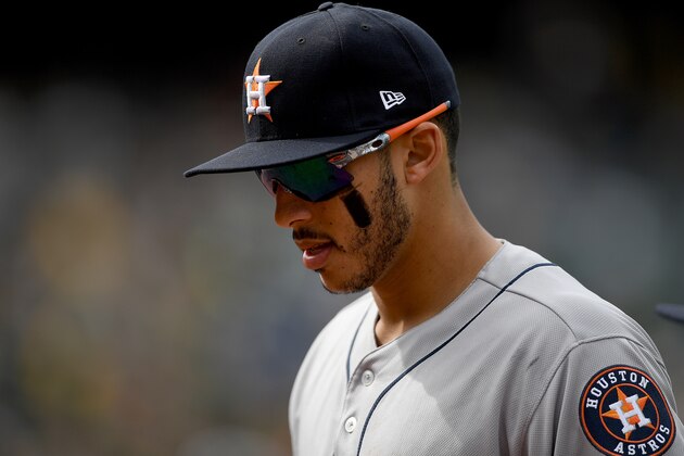 OAKLAND, CA - APRIL 15:  Carlos Correa #1 of the Houston Astros looks on as he walks off the field against the Oakland Athletics at the end of the six inning at Oakland Alameda Coliseum on April 15, 2017 in Oakland, California. All players are wearing #42 in honor of Jackie Robinson Day.  (Photo by Thearon W. Henderson/Getty Images)