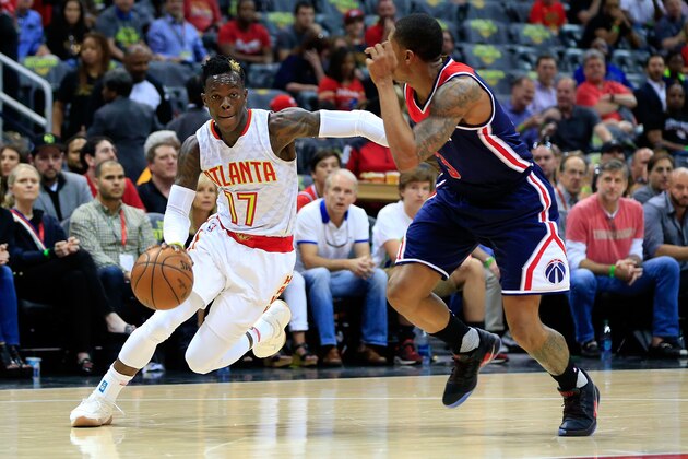 ATLANTA, GA - APRIL 22: Dennis Schroder #17 of the Atlanta Hawks drives to the basket past Bradley Beal #3 of the Washington Wizards during the first quarter in Game Three of the Eastern Conference Quarterfinals during the 2017 NBA Playoffs at Philips Arena on April 22, 2017 in Atlanta, Georgia. NOTE TO USER: User expressly acknowledges and agrees that, by downloading and or using the photograph, User is consenting to the terms and conditions of the Getty Images License Agreement. (Photo by Daniel Shirey/Getty Images)