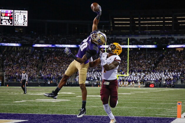 SEATTLE, WA - NOVEMBER 19:  Defensive back Kevin King #20 of the Washington Huskies makes an interception in the end zone against wide receiver N'Keal Harry #1 of the Arizona State Sun Devils on November 19, 2016 at Husky Stadium in Seattle, Washington.  (Photo by Otto Greule Jr/Getty Images)