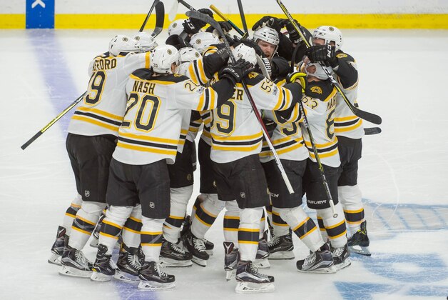Apr 21, 2017; Ottawa, Ontario, CAN; The Boston Bruins celebrate a goal by center Sean Kuraly (52) against Ottawa Senators goalie Craig Anderson (41) in overtime. The Bruins defeated the Senators 3-2 in game five of the first round of the 2017 Stanley Cup Playoffs at Canadian Tire Centre. Mandatory Credit: Marc DesRosiers-USA TODAY Sports