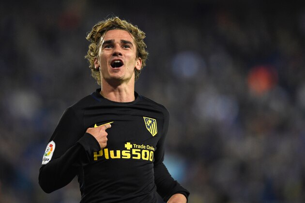 Atletico Madrid's French forward Antoine Griezmann celebrates after scoring a goal during the Spanish league football match RCD Espanyol vs Club Atletico de Madrid at the RCDE Stadium in Cornella de Llobregat on April 22, 2017. / AFP PHOTO / LLUIS GENE        (Photo credit should read LLUIS GENE/AFP/Getty Images)