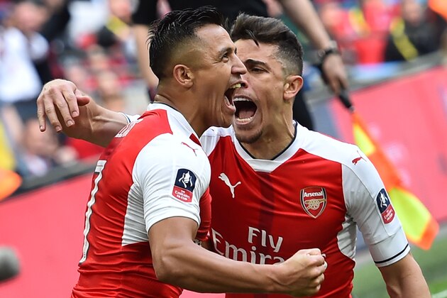 Arsenal's Chilean striker Alexis Sanchez (L) celebrates scoring their second goal with Arsenal's Brazilian defender Gabriel during the FA Cup semi-final football match between Arsenal and Manchester City at Wembley stadium in London on April 23, 2017. / AFP PHOTO / Glyn KIRK / NOT FOR MARKETING OR ADVERTISING USE / RESTRICTED TO EDITORIAL USE
        (Photo credit should read GLYN KIRK/AFP/Getty Images)