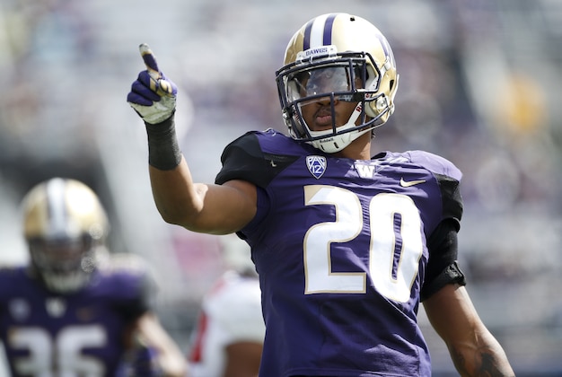 Sep 3, 2016; Seattle, WA, USA; Washington Huskies defensive back Kevin King (20) points to the stands after making a tackle for a loss against the Rutgers Scarlet Knights during the second quarter at Husky Stadium. Mandatory Credit: Jennifer Buchanan-USA TODAY Sports