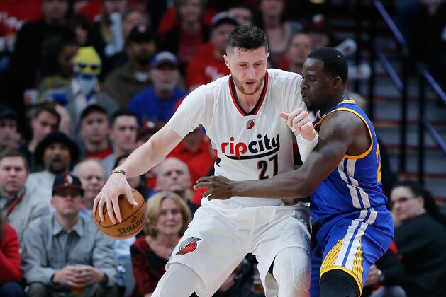 PORTLAND, OR - APRIL 22:  Jusuf Nurkic #21 of the Portland Trail Blazers is guarded by Draymond Green #23 of the Golden State Warriors during Game Three of the Western Conference Quarterfinals of  the 2017 NBA Playoffs at Moda Center on April 22, 2017 in Portland, Oregon.  NOTE TO USER: User expressly acknowledges and agrees that, by downloading and or using this photograph, User is consenting to the terms and conditions of the Getty Images License Agreement.  (Photo by Jonathan Ferrey/Getty Images)