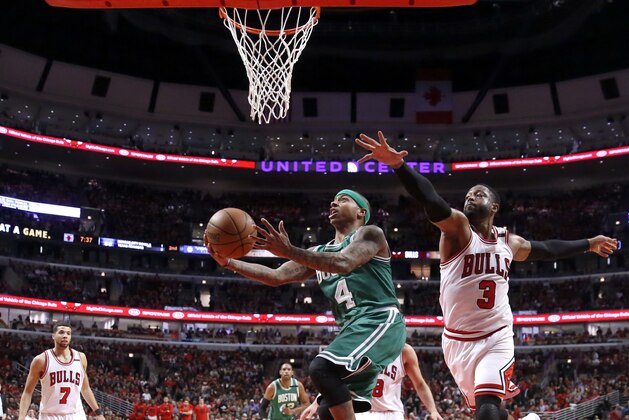 Boston Celtics' Isaiah Thomas, left, drives past Chicago Bulls' Dwyane Wade (3) as Michael Carter-Williams (7) watches during the second half in Game 3 of an NBA basketball first-round playoff series in Chicago, Friday, April 21, 2017. The Celtics won 104-87. (AP Photo/Charles Rex Arbogast)