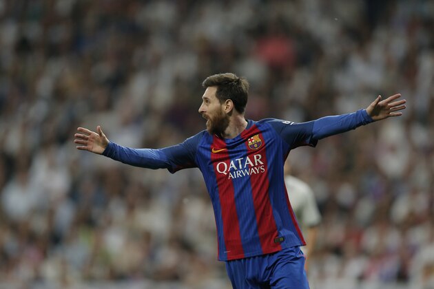 Barcelona's Lionel Messi celebrates after Ivan Rakitic scored during a Spanish La Liga soccer match between Real Madrid and Barcelona, dubbed 'el clasico', at the Santiago Bernabeu stadium in Madrid, Spain, Sunday, April 23, 2017. (AP Photo/Daniel Ochoa de Olza)