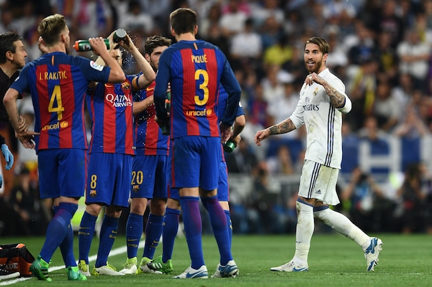 MADRID, SPAIN - APRIL 23:  Sergio Ramos of Real Madrid (R) reacts towards Barcelona players as he is sent off during the La Liga match between Real Madrid CF and FC Barcelona at Estadio Bernabeu on April 23, 2017 in Madrid, Spain.  (Photo by David Ramos/Getty Images)