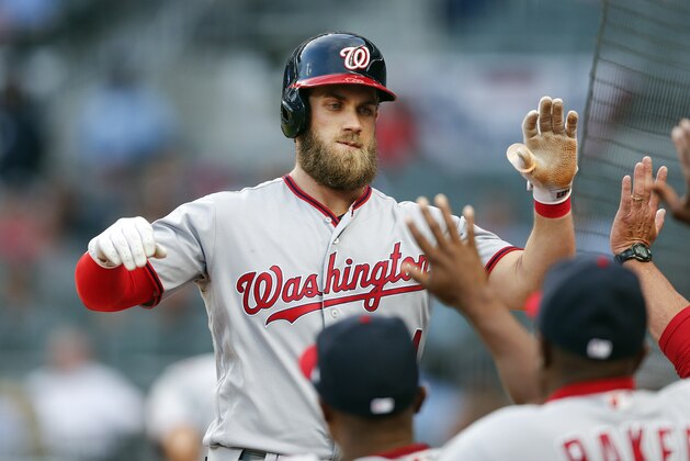 Washington Nationals right fielder Bryce Harper (34) celebrates after hitting a home run in the first inning of a baseball game against the Atlanta Braves Wednesday, April 19, 2017, in Atlanta. (AP Photo/John Bazemore)