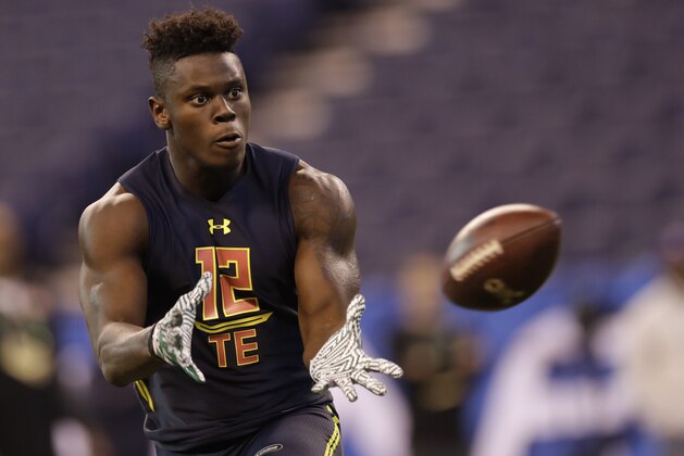 Miami tight end David Njoku runs a drill at the NFL football scouting combine Saturday, March 4, 2017, in Indianapolis. (AP Photo/David J. Phillip)