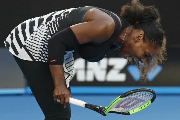 United States' Serena Williams smashes her racket during her match against her sister Venus in the women's singles final at the Australian Open tennis championships in Melbourne, Australia, Saturday, Jan. 28, 2017. (AP Photo/Kin Cheung)