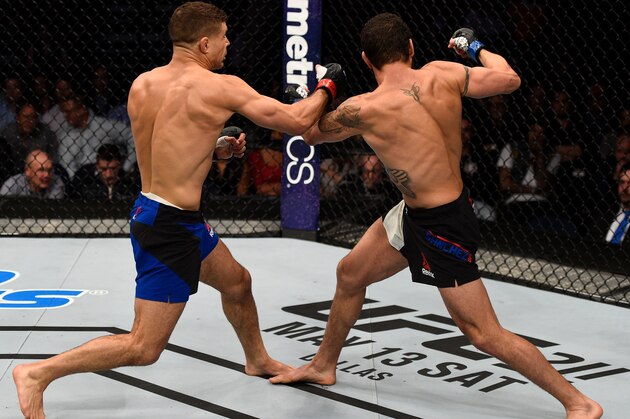 NASHVILLE, TN - APRIL 22:  (L-R) Al Iaquinta knocks down Diego Sanchez with a right in their lightweight bout during the UFC Fight Night event at Bridgestone Arena on April 22, 2017 in Nashville, Tennessee. (Photo by Jeff Bottari/Zuffa LLC/Zuffa LLC via Getty Images)