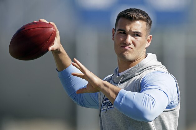 FILE - In this March 21, 2017, file photo, quarterback Mitch Trubisky passes during North Carolina's pro timing football day in Chapel Hill, N.C. The Cleveland Browns are inclined to keep the No. 1 overall pick in next week’s NFL draft despite getting offers for it. Sashi Brown, the team’s vice president of football operations, said Wednesday that the Browns “feel really good about drafting No. 1.