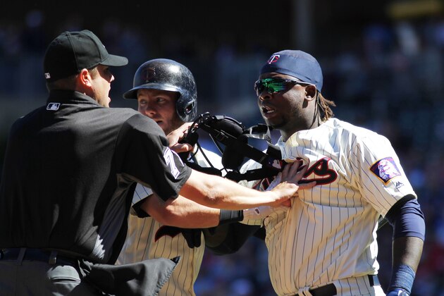 MINNEAPOLIS, MN - APRIL 22: Miguel Sano #22 of the Minnesota Twins is restrained by the home plate umpire Jordan Baker and Robbie Grossman #36 of the Minnesota Twins after an altercation with Sano and Matthew Boyd #48 of the Detroit Tigers in the fifth inning on April 22, 2017 at Target Field in Minneapolis, Minnesota. Sano and Boyd were ejected from the game. (Photo by Andy King/Getty Images)