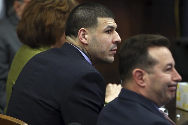 Former New England Patriots tight end Aaron Hernandez sits at the defense table during day 5 of jury deliberations in his trial at Suffolk Superior Court on Thursday, April 13, 2017. Hernandez is standing trial for the July 2012 killings of Daniel de Abreu and Safiro Furtado who he encountered in a Boston nightclub. The former NFL player is already serving a life sentence in the 2013 killing of semi-professional football player Odin Lloyd.  (Nancy Lane/The Boston Herald via AP, Pool)