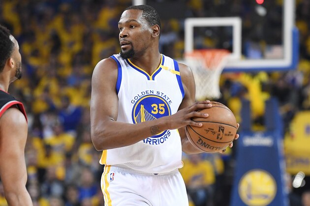 OAKLAND, CA - APRIL 16:  Kevin Durant #35 of the Golden State Warriors looks to pass the ball against the Portland Trail Blazers in the first quarter during Game One of the first round of the 2017 NBA Playoffs at ORACLE Arena on April 16, 2017 in Oakland, California. NOTE TO USER: User expressly acknowledges and agrees that, by downloading and or using this photograph, User is consenting to the terms and conditions of the Getty Images License Agreement.  (Photo by Thearon W. Henderson/Getty Images)