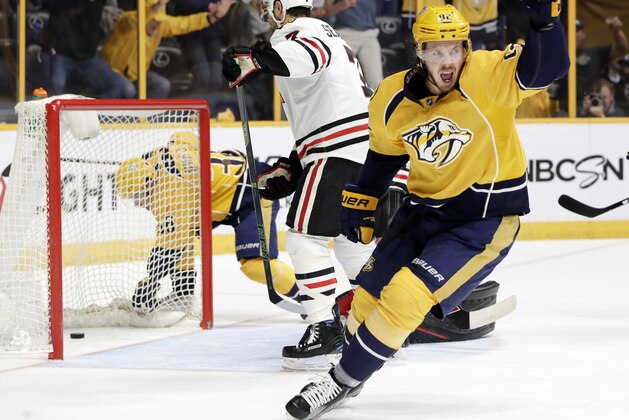Nashville Predators center Ryan Johansen (92) celebrates after teammate Roman Josi scored a goal against the Chicago Blackhawks during the second period in Game 4 of a first-round NHL hockey playoff series Thursday, April 20, 2017, in Nashville, Tenn. (AP Photo/Mark Humphrey)