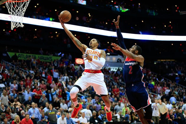 ATLANTA, GA - APRIL 24:  Kent Bazemore #24 of the Atlanta Hawks goes up for a basket against John Wall #2 of the Washington Wizards during the second quarter in Game Four of the Eastern Conference Quarterfinals during the 2017 NBA Playoffs at Philips Arena on April 24, 2017 in Atlanta, Georgia. NOTE TO USER: User expressly acknowledges and agrees that, by downloading and or using the photograph, User is consenting to the terms and conditions of the Getty Images License Agreement. (Photo by Daniel Shirey/Getty Images)