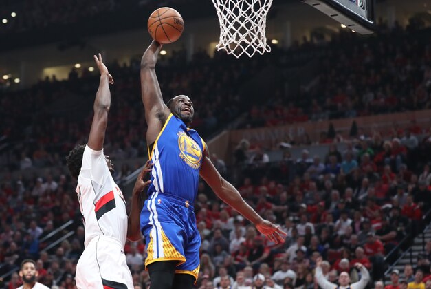 Apr 24, 2017; Portland, OR, USA; Golden State Warriors forward Draymond Green (23) attempts to dunk the ball while being fouled by Portland Trail Blazers forward Al-Farouq Aminu (8) in the first half of game four of the first round of the 2017 NBA Playoffs at Moda Center. Mandatory Credit: Jaime Valdez-USA TODAY Sports