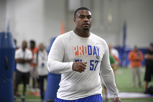 Defensive lineman Caleb Brantley (57) rests after running through a drill during Florida's NFL Pro Day in Gainesville, Fla., Tuesday, March 28, 2017. (AP Photo/Phelan M. Ebenhack)