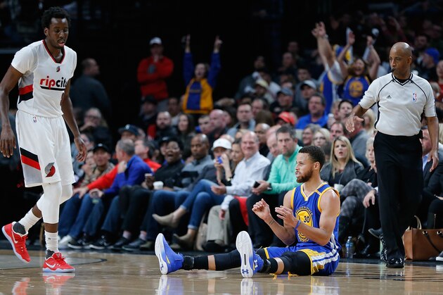 PORTLAND, OR - APRIL 24:  Stephen Curry #30 of the Golden State Warriors celebrates making a three point shot against Al Forouq Aminu #8 of the Portland Trail Blazers during Game Four of the Western Conference Quarterfinals of  the 2017 NBA Playoffs at Moda Center on April 24, 2017 in Portland, Oregon.  NOTE TO USER: User expressly acknowledges and agrees that, by downloading and or using this photograph, User is consenting to the terms and conditions of the Getty Images License Agreement.  (Photo by Jonathan Ferrey/Getty Images)